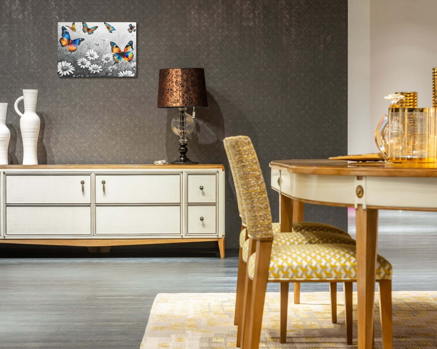 Stretched "{{product-type}}" with vibrant, colourful butterflies flying over a black and white field of daisies. The "{{title}}" design is a beautiful piece of nature-inspired wall art.