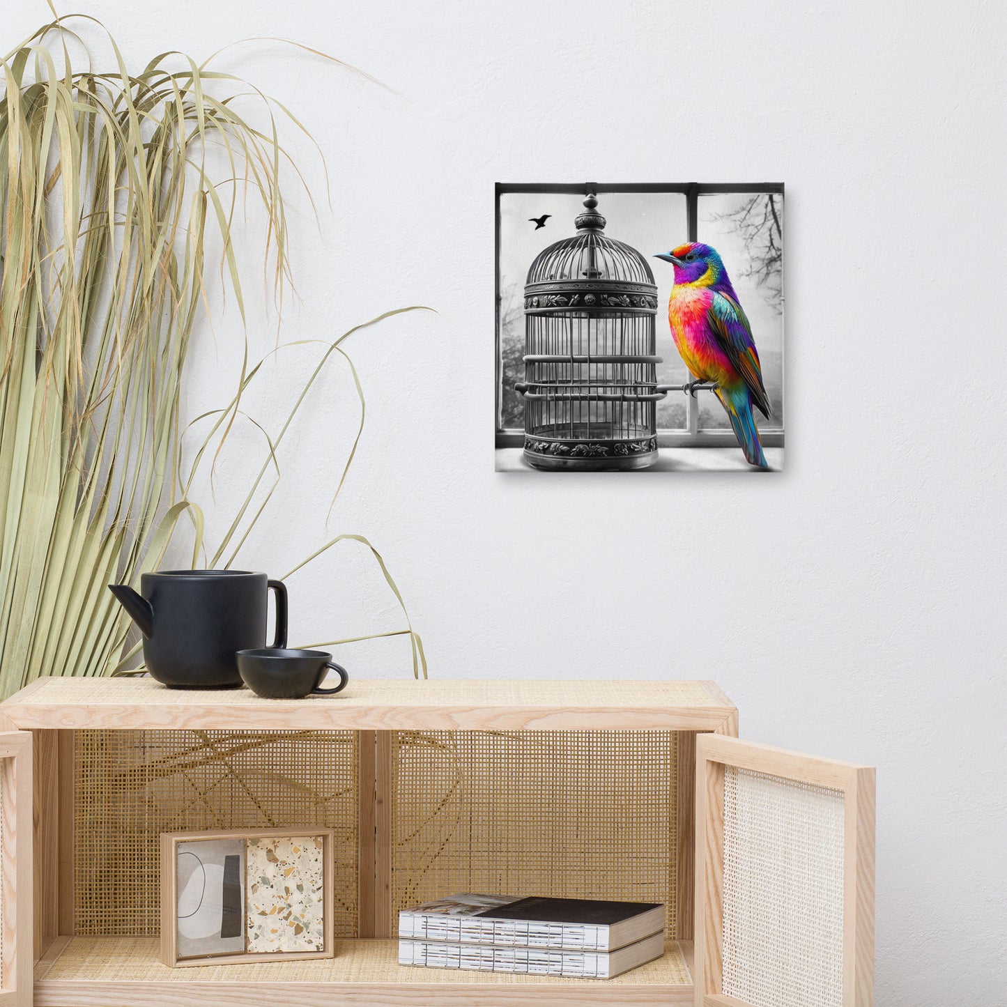 Square canvas print featuring a vibrant rainbow-colored bird with a black and white background of a birdcage. Symbolic and striking wall art for a modern living space.