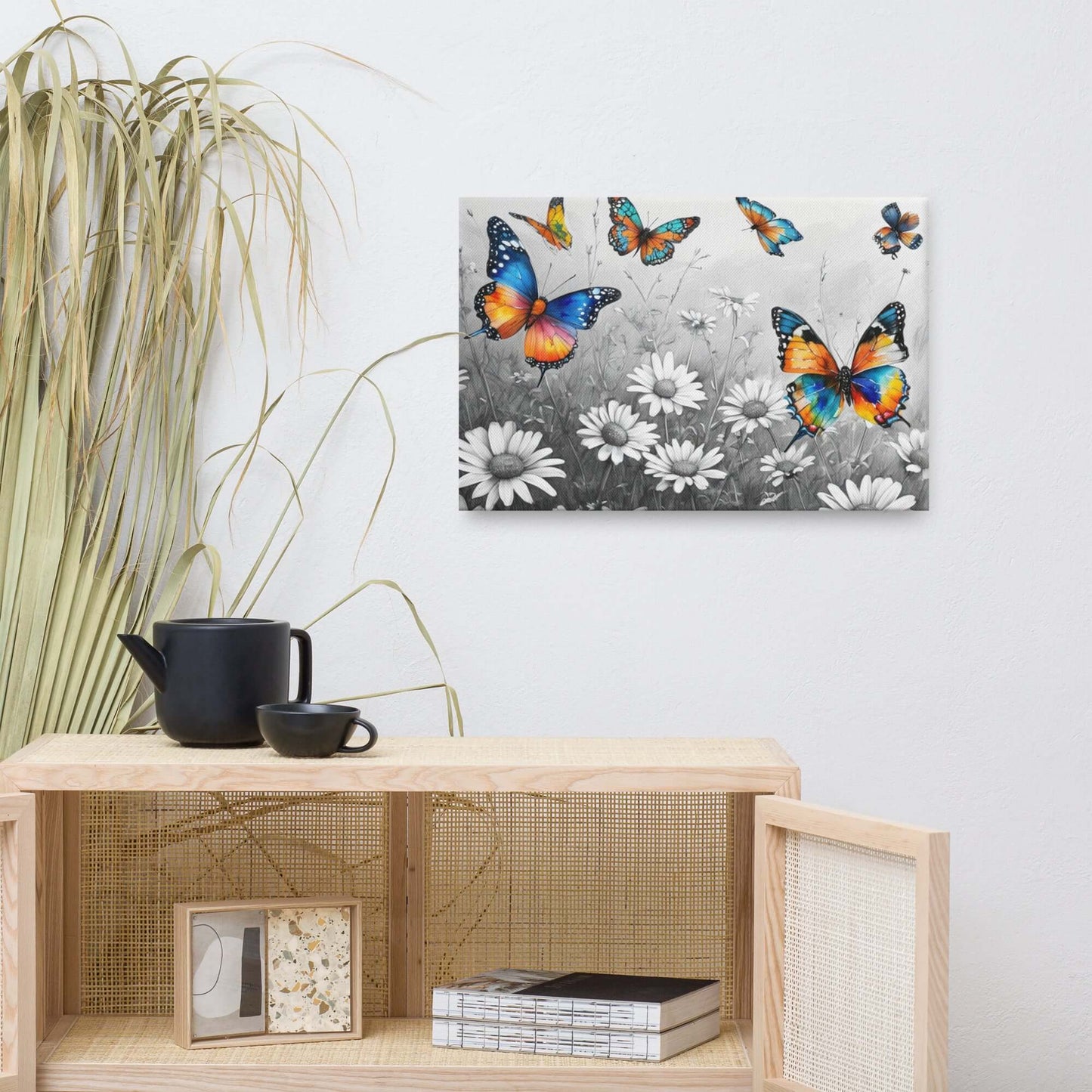 Stretched "{{product-type}}" with vibrant, colourful butterflies flying over a black and white field of daisies. The "{{title}}" design is a beautiful piece of nature-inspired wall art.