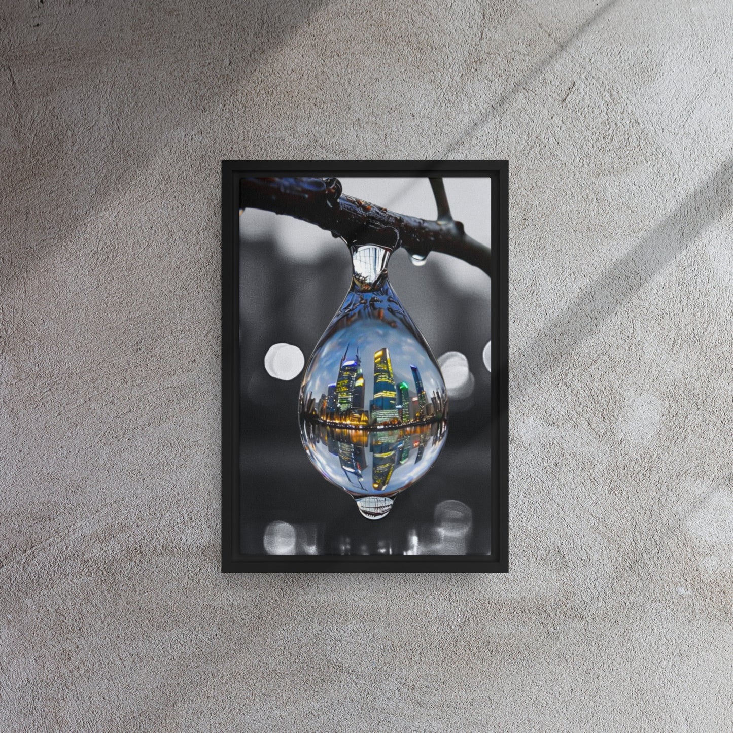 Framed canvas art print of a colorful city skyline reflected in a water droplet. Features unique abstract photography with vibrant colors against a monochrome background. Modern and stylish wall decor.