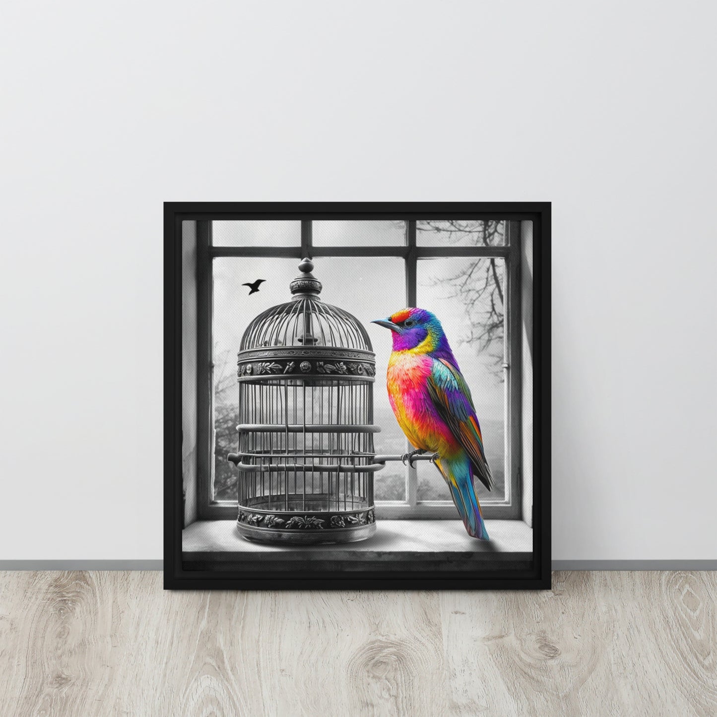 Framed canvas art print featuring a colorful rainbow bird next to a black and white birdcage. Symbolic wall decor for modern and unique home spaces.