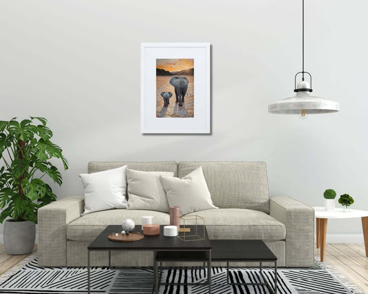 Framed "{{product-type}}" featuring a mother and baby elephant with the title "{{title}}". A thoughtful nursery and new mum gift.