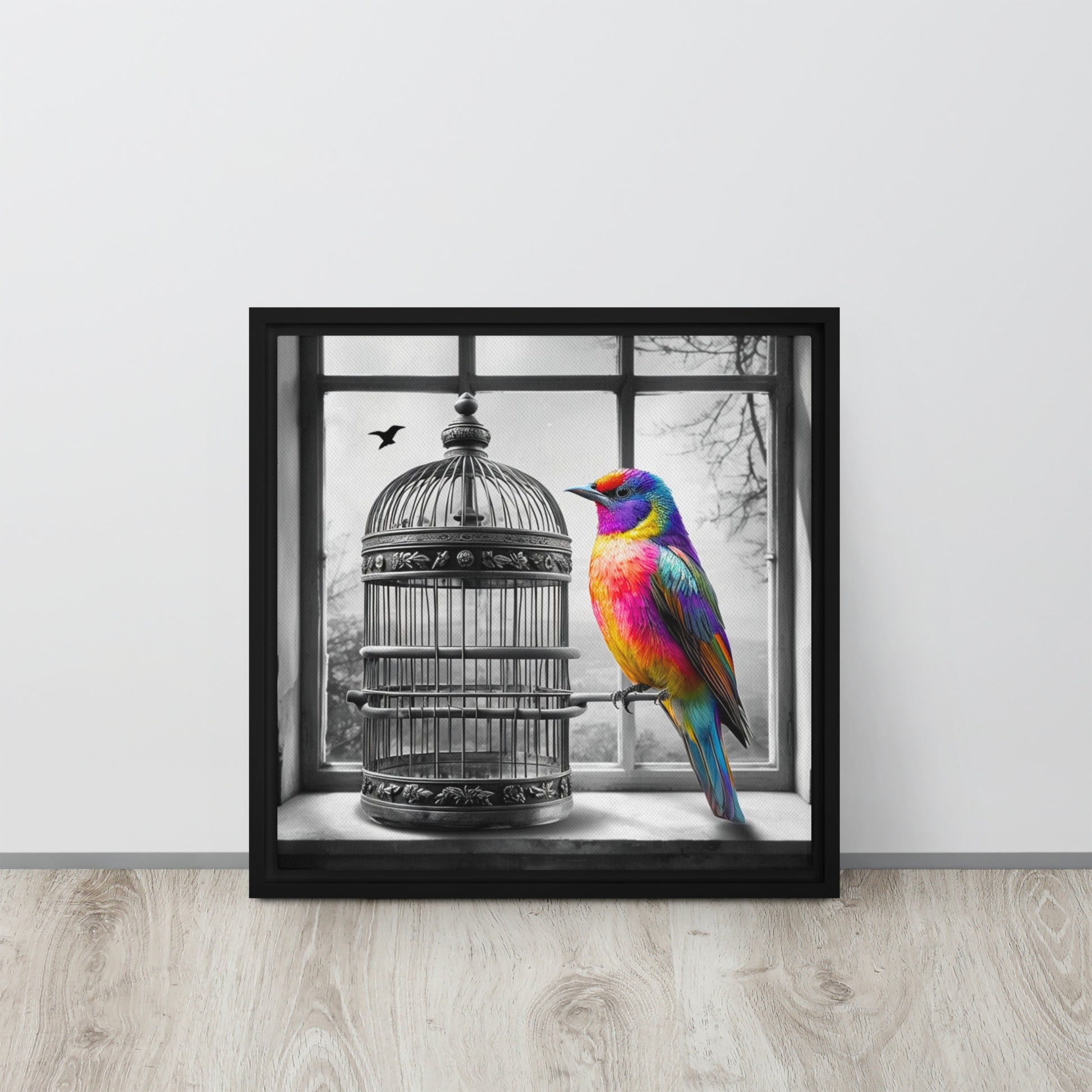 Framed canvas art print featuring a colorful rainbow bird next to a black and white birdcage. Symbolic wall decor for modern and unique home spaces.