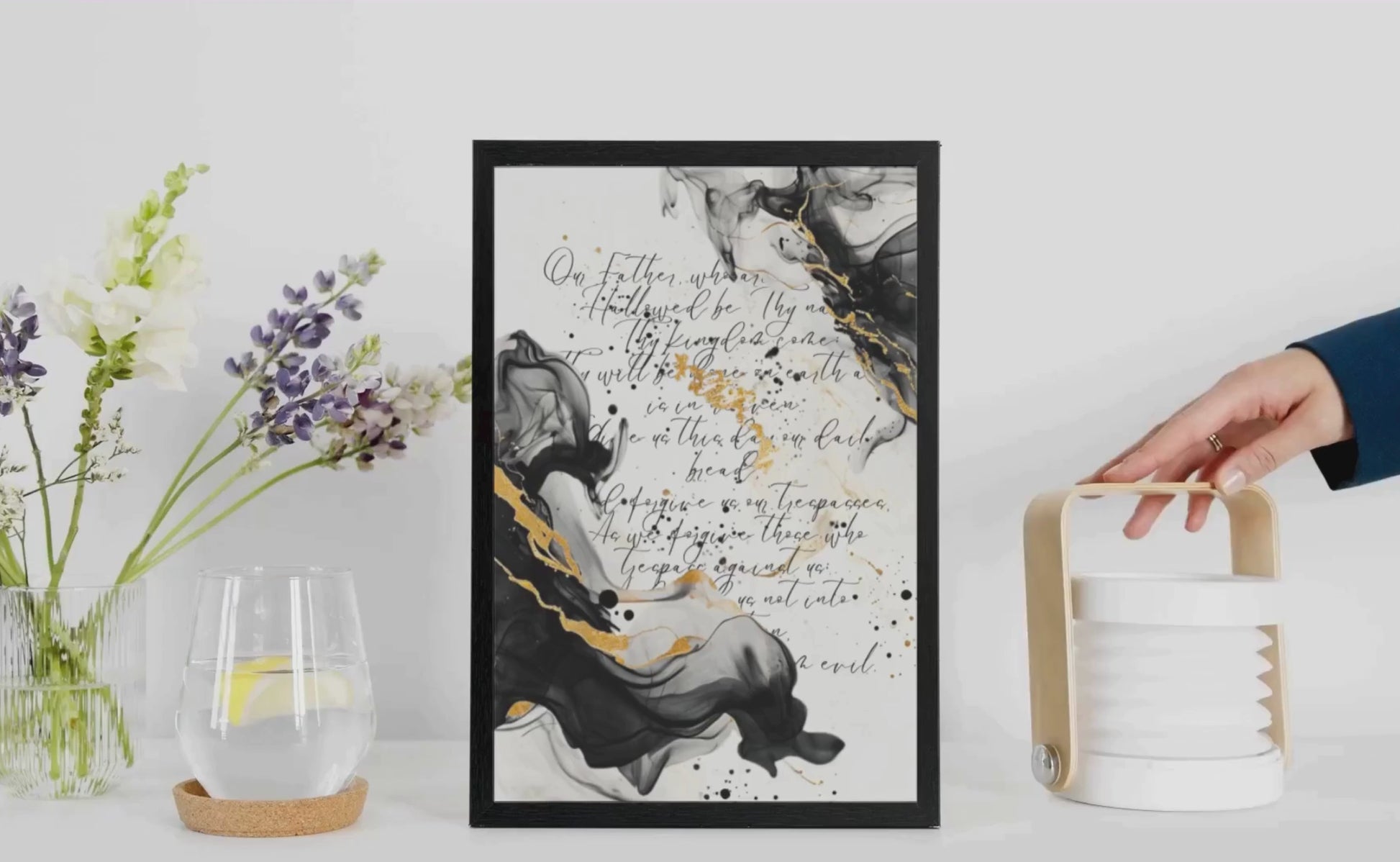 Framed scripture art poster with black and gold abstract marble design. Features the Lord's Prayer in elegant calligraphy. Ideal for religious home decor and inspirational wall art.